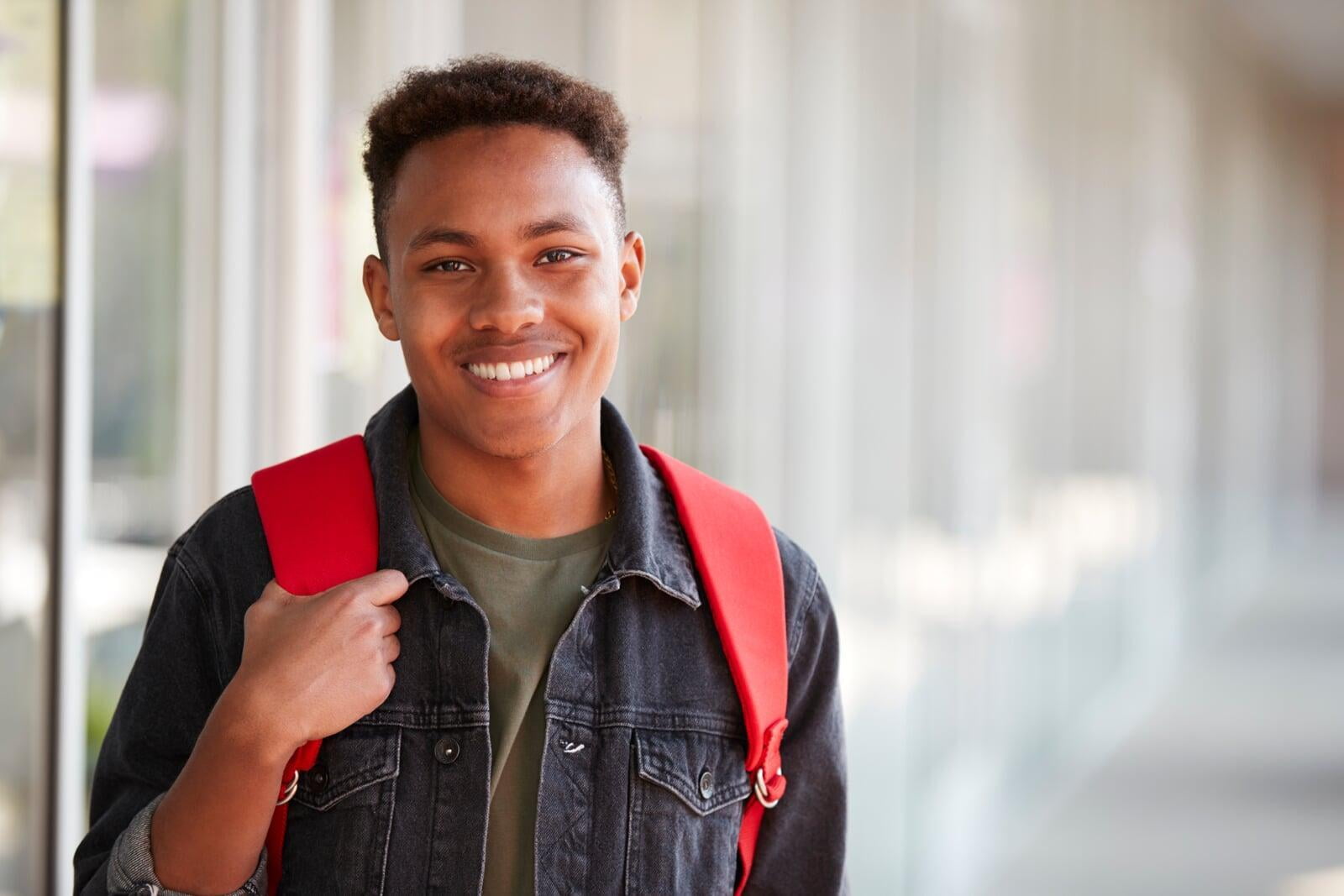 High school aged student with backpack.